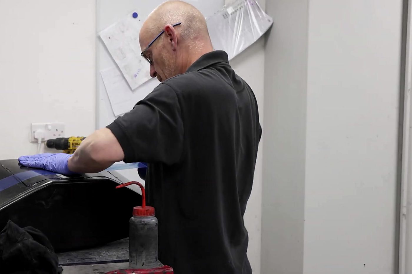 Technician working on a finished carbon fibre component
