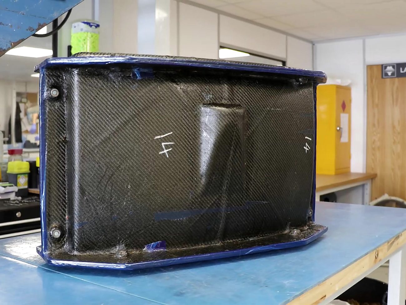 Finished carbon fibre enclosure on the bench in the laminating room