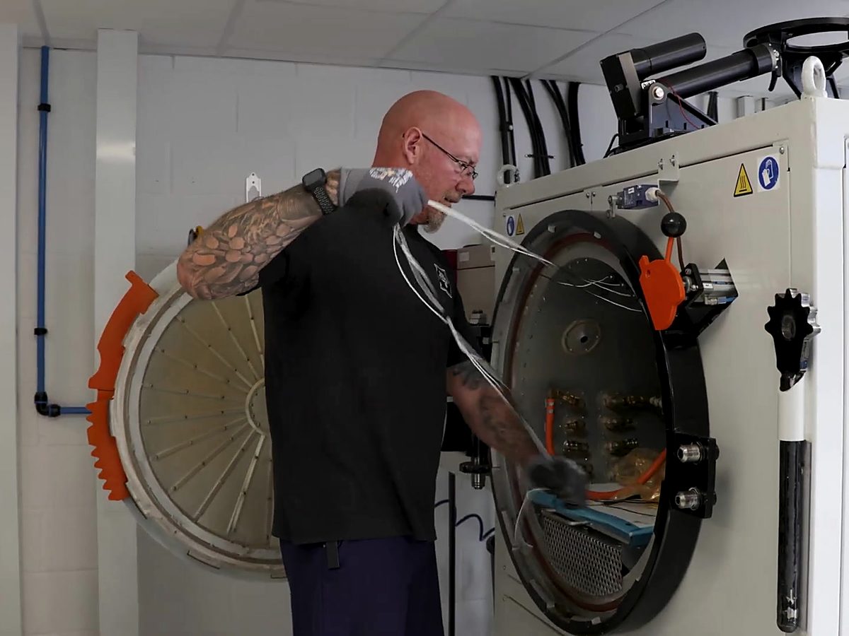 Technician connecting vacuum lines before a cure
